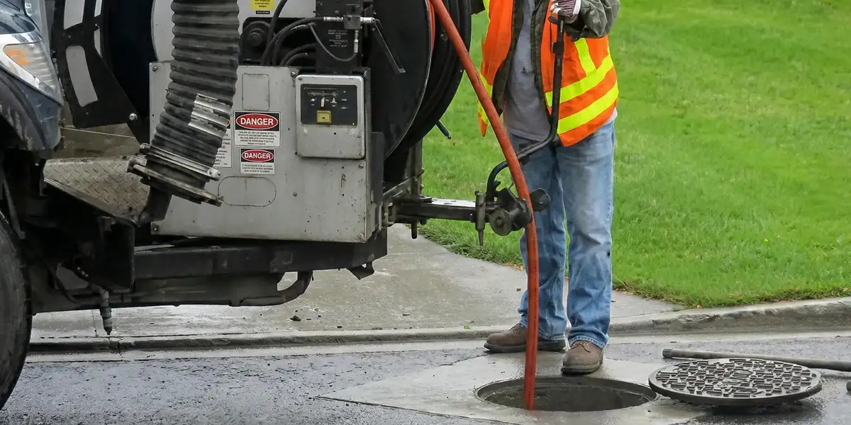 sewage clean up professionals using industrial equipment to remove contaminated wastewater in Houston, TX