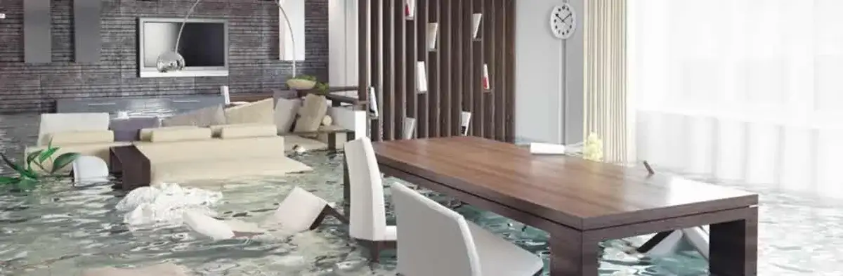 home interior affected by water damage with flooded floors and displaced furniture in Houston, TX